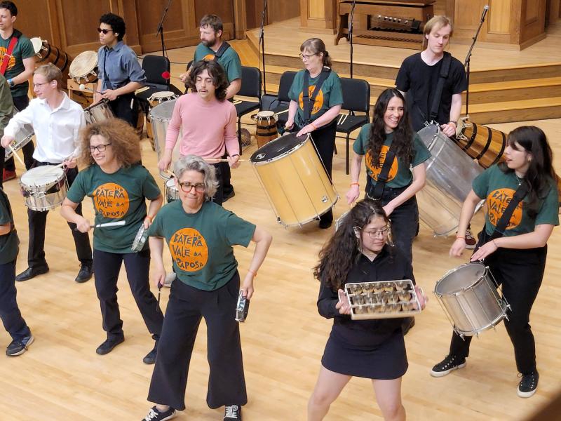 Ensemble members performing on chapel stage