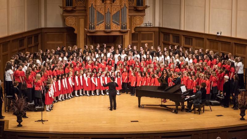 All seven Girl Choirs sing onstage for the finale in the Lawrence Chapel.