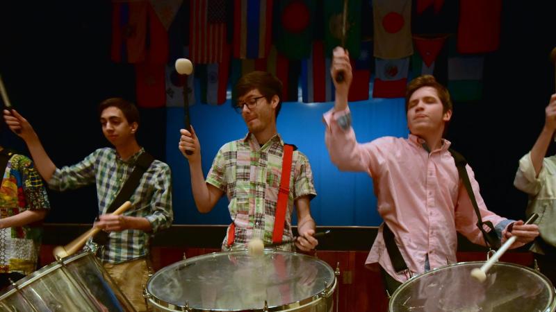 4 men playing drums